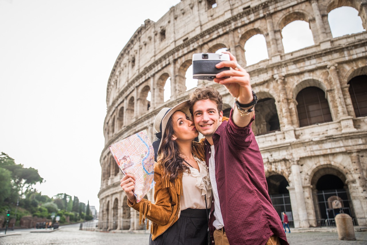 A happy couple enjoying their faith-based journey in Rome.