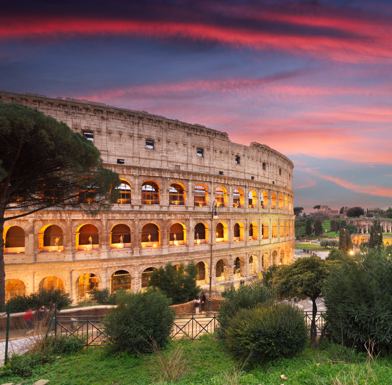A beautiful evening view of the Colosseum in Rome, Italy, symbolizing a historic journey.